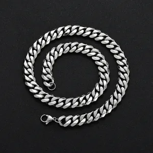 Close-up of 12mm stainless steel Cuban link necklace with a polished lobster clasp