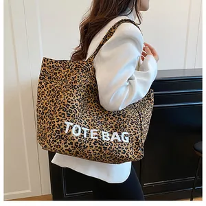 Detailed view of leopard print tote bag showing large capacity and stylish fabric texture