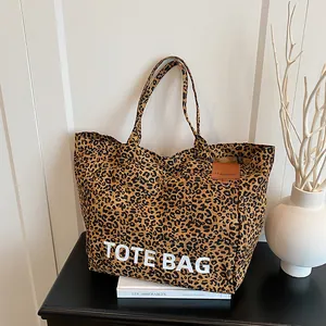 Stylish leopard print tote bag for women featuring white lettering and a large capacity