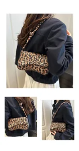 Detail of leopard print shoulder bag with knotted strap and textured flap closure