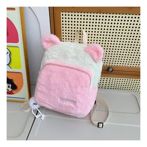 Close-up of fluffy pink and white plush backpack featuring cute animal ears and soft fur texture