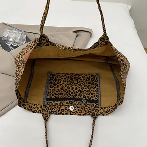 Spacious leopard print canvas tote bag with magnetic closure and internal zip pocket