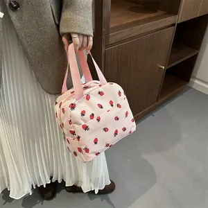 Cute strawberry print corduroy lunch bag with pink handles and stripe pattern design