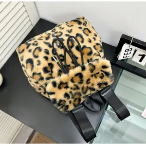 Detail shot of plush leopard print faux fur backpack texture and drawstring closure