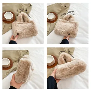Detail view showing plush faux fur texture and dark grey metal chain of the beige bag