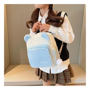 Detail of soft plush texture and blue-white patchwork design on stylish furry backpack