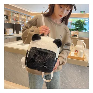 Close-up of fluffy panda-shaped plush backpack with 3D ears and soft faux fur texture
