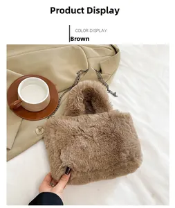 Detailed view of the brown plush handbag with dark grey metal chain and flap closure