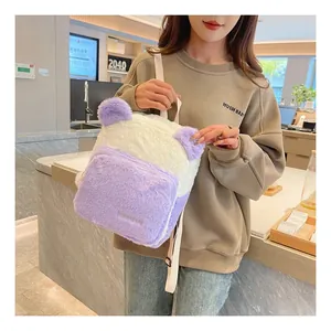 Detail of plush panda backpack showing fluffy purple texture and brand embroidery