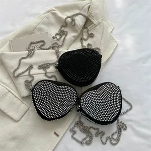 Sparkling heart-shaped rhinestone crossbody bags in black, silver and iridescent colors