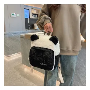 Close-up of soft plush panda backpack with black zipper pocket and white handle straps