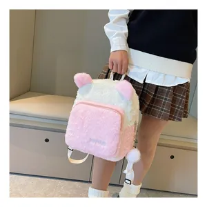 Detail of pink and white plush backpack featuring cute ears and soft faux fur texture