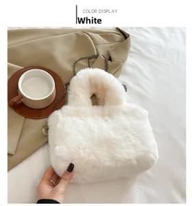 Detail of soft white plush crossbody bag with dark metal chain strap for autumn style