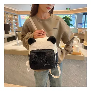 Close-up of plush panda backpack showing soft faux fur and 3D ears detail