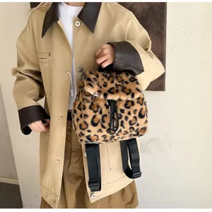 Detail of plush leopard print backpack with drawstring closure and soft faux fur texture