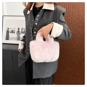 Detail of pink faux fur crossbody bag with soft texture and elegant silver chain strap