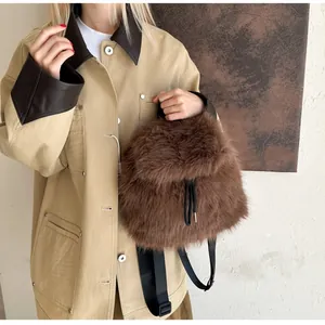 Detail of soft dark brown faux fur texture on a drawstring backpack with nylon straps