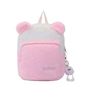 Pink and white fuzzy plush backpack for girls with cute bear ears and charm