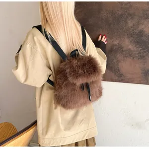 Rear view of a model wearing the brown faux fur backpack with adjustable straps