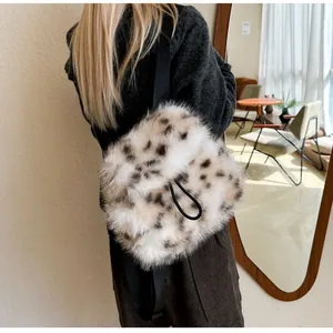 Detail of soft leopard print faux fur backpack with black straps and drawstring closure