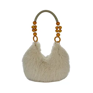 Plush beige faux fur tote bag with amber beads and green woven top handle for winter fashion