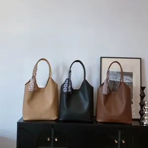 Three minimalist large capacity tote bags in beige black and brown with silk scarves