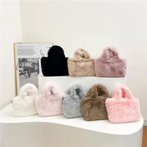 Chic faux fur crossbody tote bags in multiple autumn colors on a tiered display stand