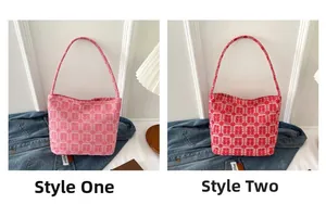 Detail of red and pink bridal tote bags featuring traditional Chinese Xi character prints