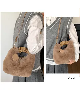 Detail of khaki plush tote bag with ruched leather handle and soft faux fur texture