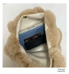 Detail of plush tote bag interior capacity with magnetic closure and smooth lining