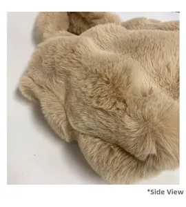 Side view detail of plush faux fur tote bag showing thick beige soft material texture