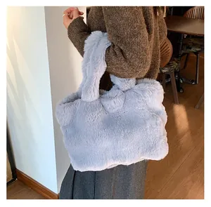 Detail showing the fluffy lavender faux fur texture of the large winter tote bag