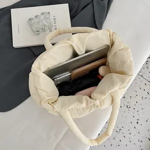 Spacious off-white quilted puffer tote bag for women showing large interior capacity