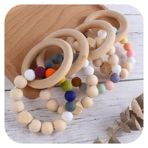 Umweltfreundlicher Beißring aus Silikon und Holz in Macaron-Farben für Babys