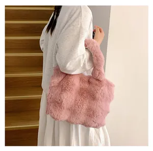 Detailed close-up of fluffy pink faux fur texture on a large winter tote bag