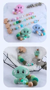 Close-up of elephant teething set with silicone beads, beech wood, and crochet balls