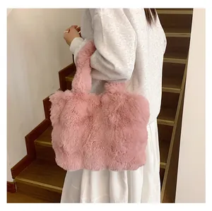 Detailed texture of pink plush tote bag with soft faux fur and thick handles