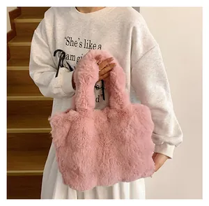 Detailed view of pink plush tote bag with soft faux fur texture for women's autumn style