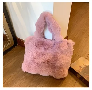 Detail of soft pink faux fur tote bag showing plush texture and thickened top handles