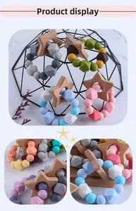 Macro detail of natural beech wood star and colorful silicone beads baby teether ring
