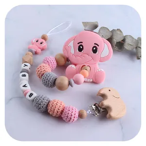 Pink silicone elephant baby teether with wooden beads and crochet pacifier chain