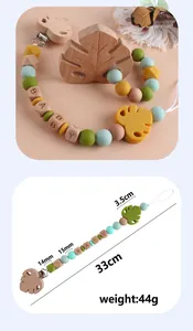 Detail view of beech wood leaf teether and silicone beads on pacifier clip with dimensions