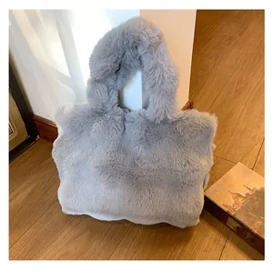 Detail of plush grey faux fur tote bag showing soft texture and cozy winter aesthetic