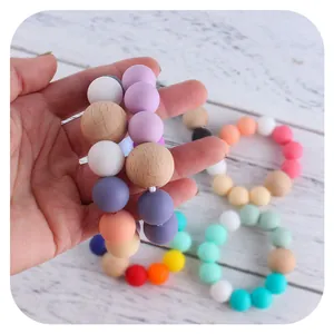 Braccialetti da dentizione per neonati in silicone e legno di faggio, vari colori vivaci