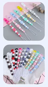 Close-up of silicone pacifier clip chain with macaron color beads and plastic duckbill clip