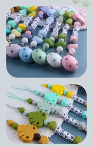 Detail of baby pacifier clips with silicone beads and leaf accents in Morandi colors