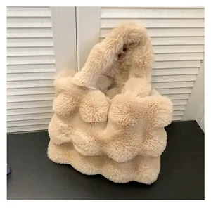Detail showing the soft fluffy texture and wavy design of the beige faux fur tote bag