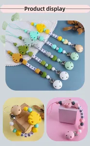 Close-up of silicone baby pacifier clip with beech wood, leaf beads and BABY letters