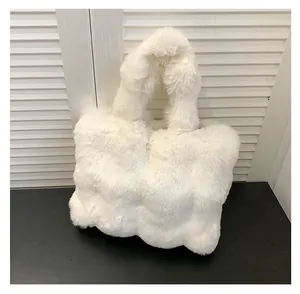 Detailed view of white plush tote bag with soft faux fur texture and square grid patterns
