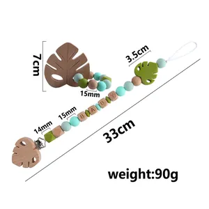 Baby pacifier clip with silicone beads and beech wood leaf teether toy set in green